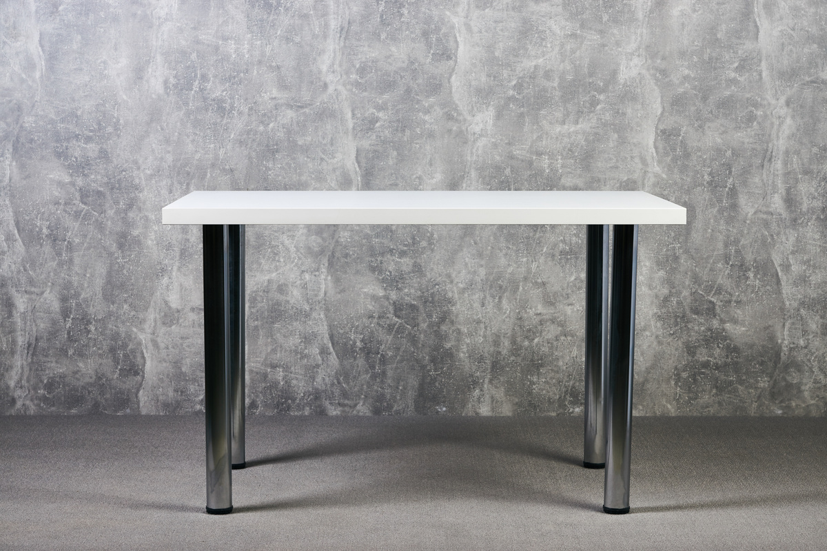 White wooden table with leg in office, indoor